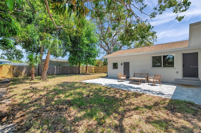 1401 49th St N, Saint Petersburg, FL 33710 - view of yard featuring a patio