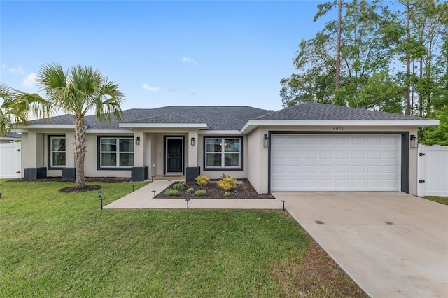 6873 SW 131st Pl, Ocala, FL 34473 - single story home with fence, an attached garage, stucco siding, a front yard, and driveway