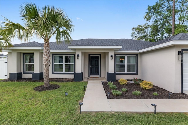 6873 SW 131st Pl, Ocala, FL 34473 - ranch-style home featuring a shingled roof, a front lawn, and stucco siding