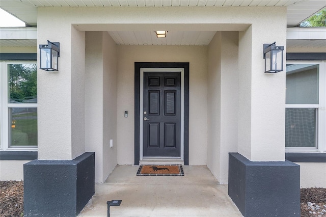 6873 SW 131st Pl, Ocala, FL 34473 - view of exterior entry featuring stucco siding