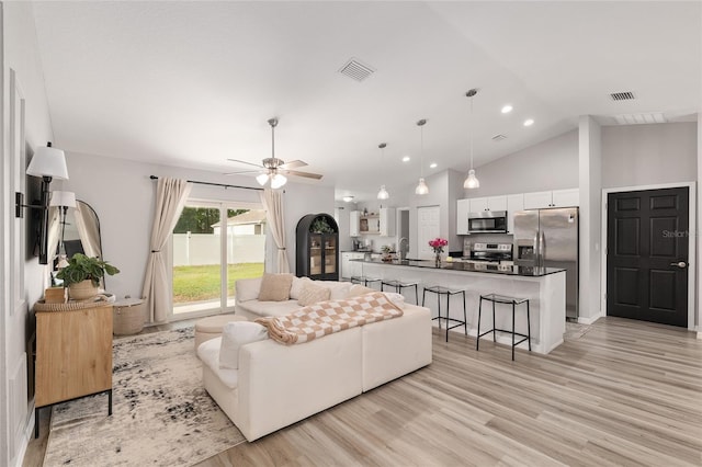 6873 SW 131st Pl, Ocala, FL 34473 - living area with ceiling fan, visible vents, high vaulted ceiling, and light wood-style floors