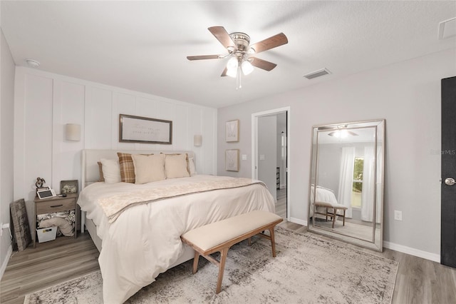 6873 SW 131st Pl, Ocala, FL 34473 - bedroom with baseboards, ceiling fan, light wood-type flooring, and visible vents