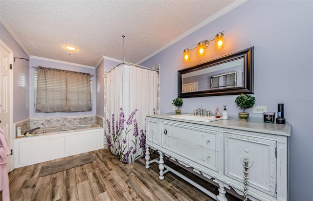 678 Greenglen Ln, Palm Harbor, FL 34684 - full bathroom featuring a textured ceiling, vanity, a garden tub, crown molding, and wood finished floors