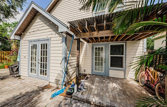 678 Greenglen Ln, Palm Harbor, FL 34684 - wooden terrace featuring french doors and a patio
