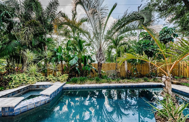 678 Greenglen Ln, Palm Harbor, FL 34684 - view of swimming pool with a fenced backyard and a pool with connected hot tub