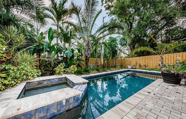 678 Greenglen Ln, Palm Harbor, FL 34684 - view of pool with an in-ground hot tub and a fenced backyard