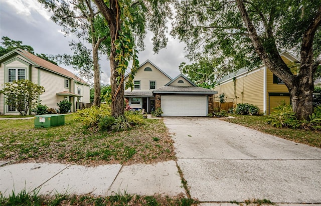 678 Greenglen Ln, Palm Harbor, FL 34684 - view of front of house featuring an attached garage and driveway