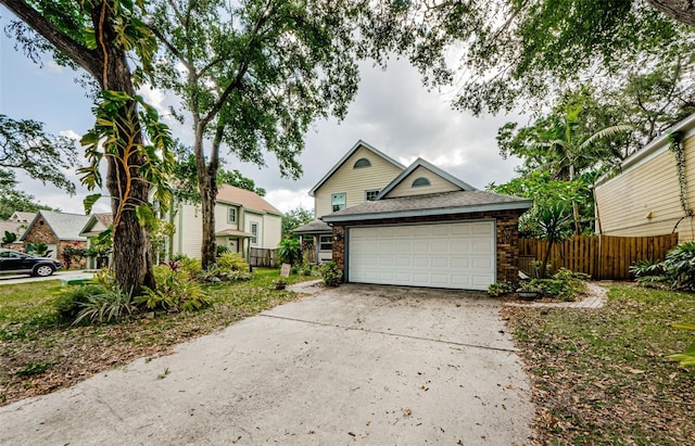 678 Greenglen Ln, Palm Harbor, FL 34684 - view of front of property featuring driveway, a garage, and a shingled roof