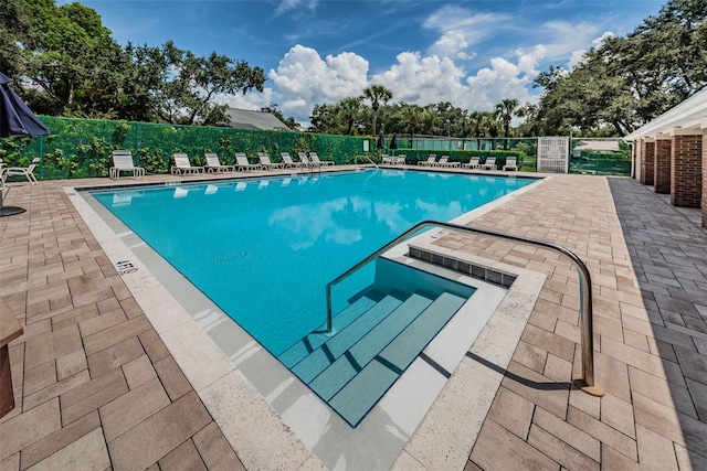 678 Greenglen Ln, Palm Harbor, FL 34684 - community pool featuring a patio