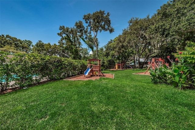 678 Greenglen Ln, Palm Harbor, FL 34684 - view of grassy yard featuring a playground