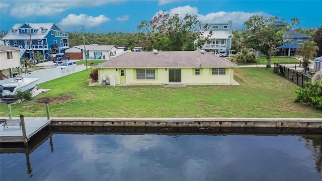 814 Seabreeze Dr, Ruskin, FL 33570 - back of property with a water view and a shingled roof