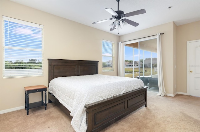 bedroom featuring light colored carpet, access to outside, baseboards, and ceiling fan