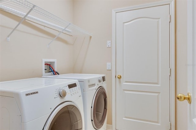 laundry room with independent washer and dryer