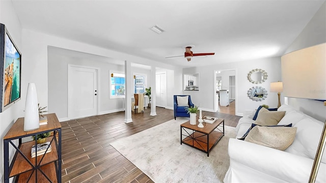 1402 Freemont St S, Gulfport, FL 33707 - living area with wood finished floors, a ceiling fan, and baseboards