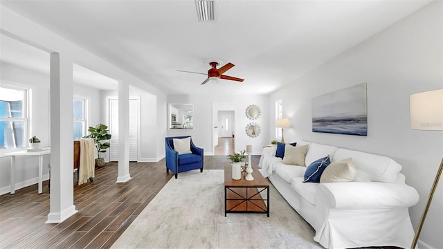 1402 Freemont St S, Gulfport, FL 33707 - living area featuring dark wood-type flooring, baseboards, and ceiling fan