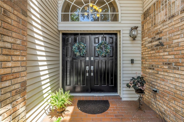 13785 Oak Forest Blvd S, Seminole, FL 33776 - doorway to property featuring brick siding