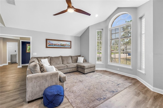 13785 Oak Forest Blvd S, Seminole, FL 33776 - living room featuring baseboards, ceiling fan, lofted ceiling, and visible vents