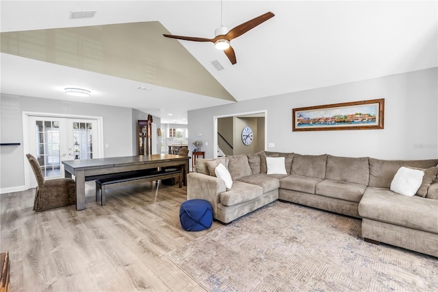 13785 Oak Forest Blvd S, Seminole, FL 33776 - living area featuring ceiling fan, high vaulted ceiling, french doors, wood finished floors, and visible vents