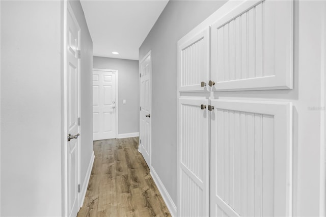 13785 Oak Forest Blvd S, Seminole, FL 33776 - corridor featuring recessed lighting, baseboards, and light wood finished floors