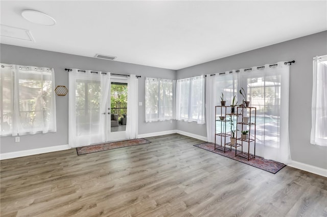 13785 Oak Forest Blvd S, Seminole, FL 33776 - interior space featuring baseboards, wood finished floors, visible vents, and french doors