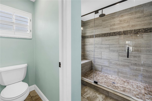 13785 Oak Forest Blvd S, Seminole, FL 33776 - full bath with baseboards, a stall shower, and toilet