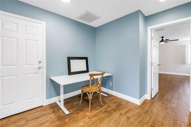 13785 Oak Forest Blvd S, Seminole, FL 33776 - office with baseboards, ceiling fan, wood finished floors, and visible vents