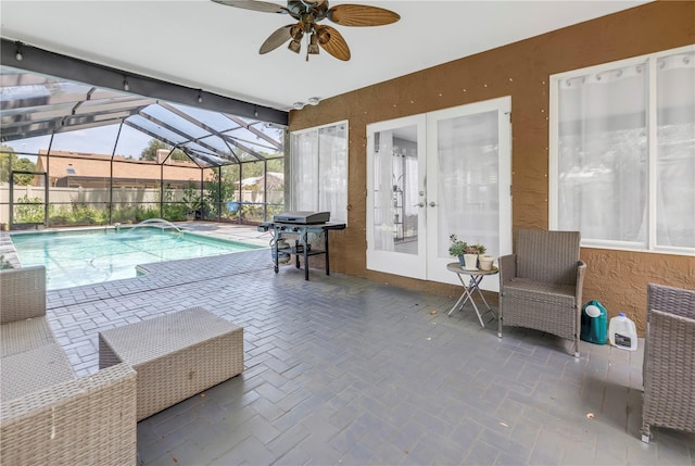 13785 Oak Forest Blvd S, Seminole, FL 33776 - view of swimming pool featuring ceiling fan, french doors, a patio area, a fenced in pool, and a grill