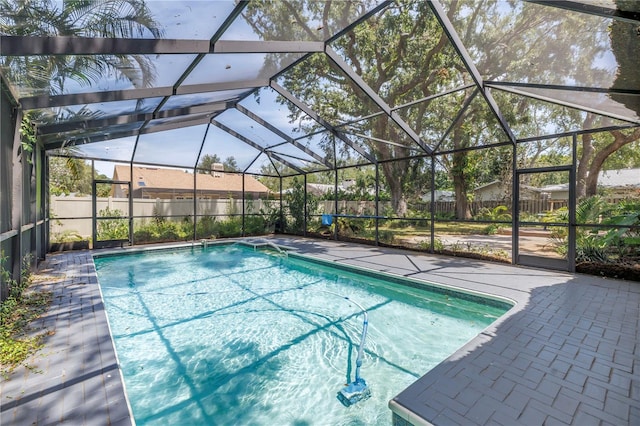 13785 Oak Forest Blvd S, Seminole, FL 33776 - view of swimming pool featuring fence, a fenced in pool, a lanai, and a patio