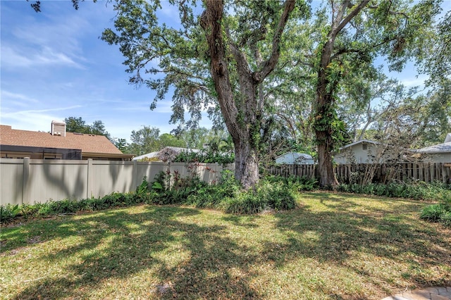13785 Oak Forest Blvd S, Seminole, FL 33776 - view of yard featuring a fenced backyard