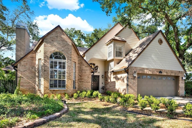 13785 Oak Forest Blvd S, Seminole, FL 33776 - view of front of home featuring brick siding, a garage, driveway, and a chimney