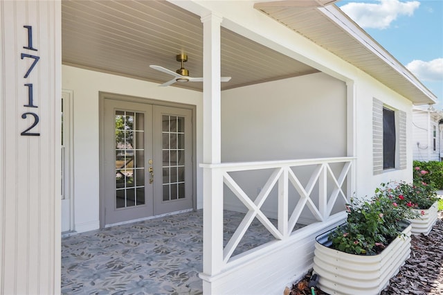 property entrance featuring french doors and ceiling fan