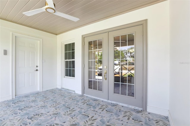 doorway to property featuring a ceiling fan and french doors