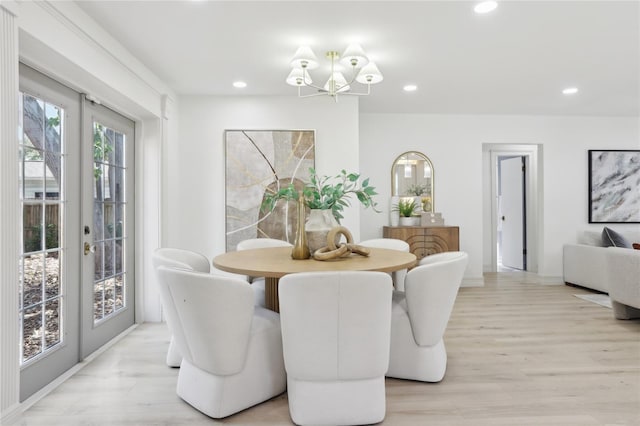 dining space featuring a chandelier, recessed lighting, and light wood-style floors