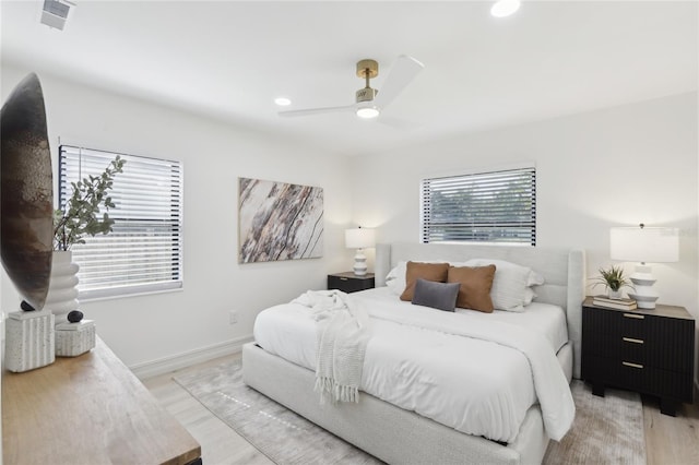bedroom with recessed lighting, light wood-style floors, baseboards, visible vents, and a ceiling fan