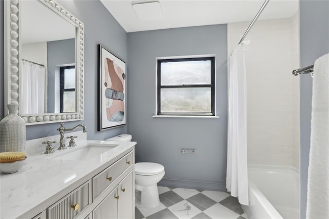 full bath featuring tile patterned floors, toilet, vanity, baseboards, and shower / tub combo