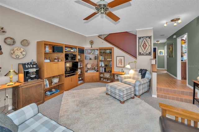 5115 S Jules Verne Ct, Tampa, FL 33611 - living area featuring carpet flooring, a ceiling fan, visible vents, ornamental molding, and a textured ceiling