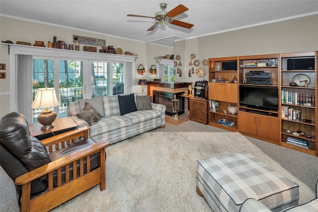 5115 S Jules Verne Ct, Tampa, FL 33611 - carpeted living area featuring a textured ceiling, ceiling fan, french doors, and crown molding