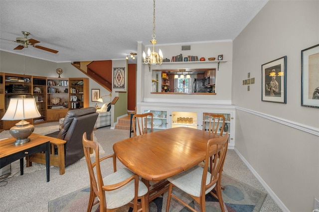 5115 S Jules Verne Ct, Tampa, FL 33611 - dining room with a textured ceiling, visible vents, carpet flooring, and ceiling fan with notable chandelier