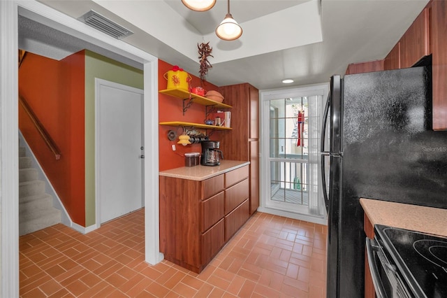 5115 S Jules Verne Ct, Tampa, FL 33611 - kitchen featuring brick floor, visible vents, open shelves, and brown cabinetry