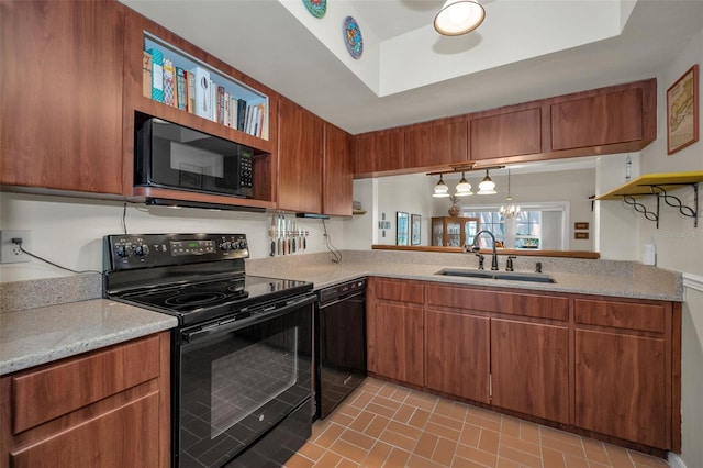 5115 S Jules Verne Ct, Tampa, FL 33611 - kitchen with light countertops, brown cabinets, black appliances, a sink, and brick patterned floor