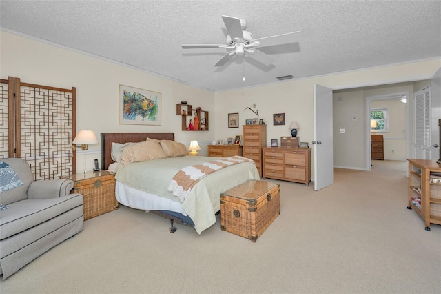 5115 S Jules Verne Ct, Tampa, FL 33611 - bedroom with light colored carpet, ceiling fan, visible vents, and a textured ceiling
