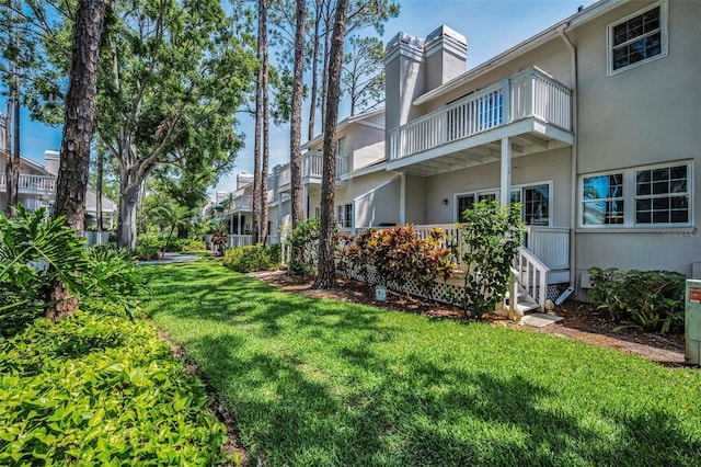 5115 S Jules Verne Ct, Tampa, FL 33611 - view of yard featuring a balcony