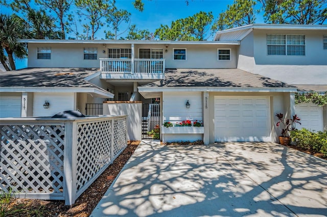 5115 S Jules Verne Ct, Tampa, FL 33611 - view of front of property featuring fence, stucco siding, and driveway