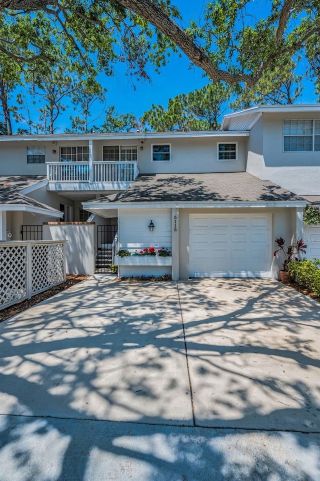 5115 S Jules Verne Ct, Tampa, FL 33611 - multi unit property with an attached garage, concrete driveway, and stucco siding
