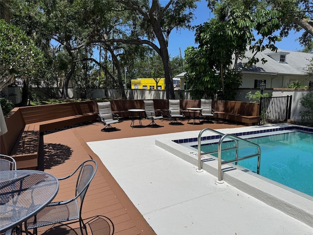 5115 S Jules Verne Ct, Tampa, FL 33611 - view of pool featuring fence, a wooden deck, and a fenced in pool