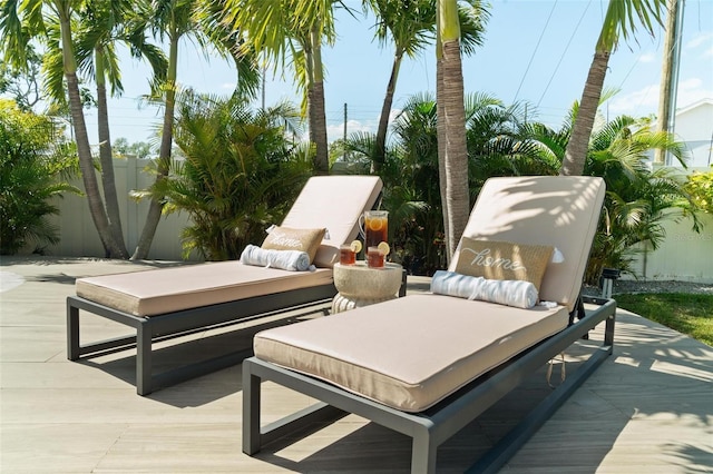 exterior space with outdoor lounge area, a patio, and fence