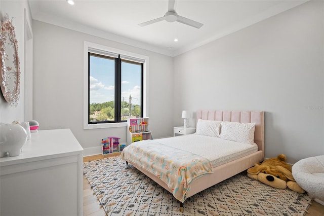 bedroom featuring recessed lighting, a ceiling fan, light wood-style floors, crown molding, and baseboards