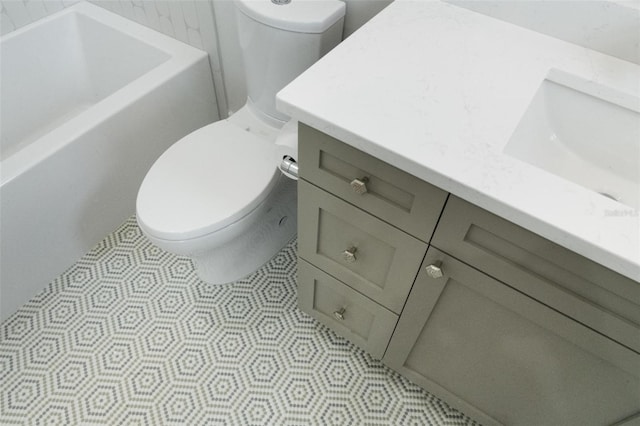 bathroom with toilet and vanity