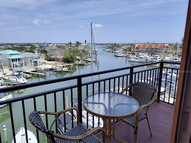 balcony featuring a water view