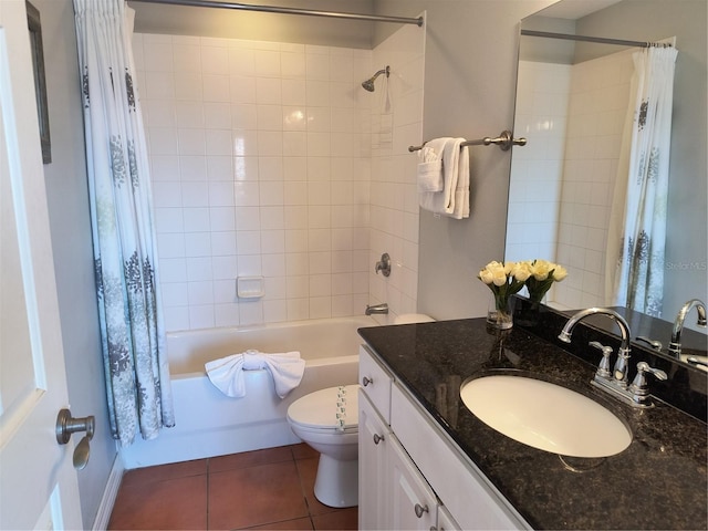 bathroom with vanity, shower / tub combo with curtain, tile patterned floors, and toilet